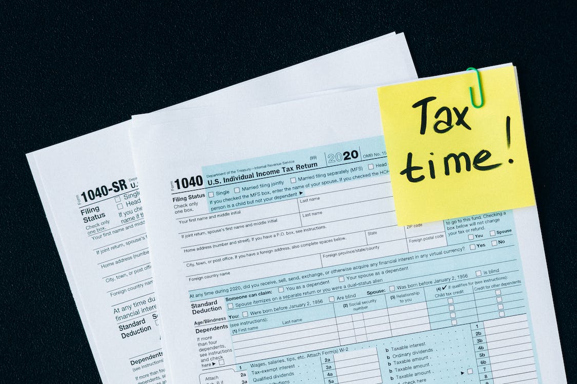 1040 forms with a note saying “tax time!”